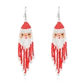 Detailed close-up of handmade beaded Santa Claus earrings with festive red and white fringes - Red Santa Claus Style