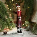 Resin Christmas girl figurine in red sweater, 28.5cm height for festive table decoration - Red Hat Heart Girl