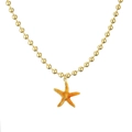Macro detail of the orange starfish pendant with gold bead chain and realistic textures - Orange