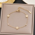 Elegant gold stainless steel bracelet with five round clear zircon charms in a jewelry box - Gold Five Circles Inlaid Rhinestone Style (5175)
