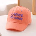 Close-up of purple embroidery with text and smiley face on pink cotton baseball cap - 52cm (2-5 Years) / Orange