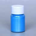 Vibrant bright blue pearlescent mica powder in a small glass jar with a white screw cap - Pearl Powder #14 Sky Blue