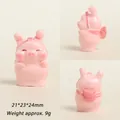 Detailed macro view showing three-sided layout of 3D resin pig with schoolbag - Pink Backpack Pink Pig