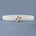 Detail showing white pearl beaded waist belt with a gold flower buckle and colored gemstones - 19303 Gold Flower Buckle