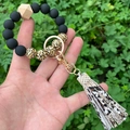Detail of leopard print beads and snake pattern tassel on a silicone beaded keychain - Snake PU Tassel Black Gold Leopard Beaded (款23)