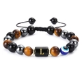 Detail of adjustable tiger eye bead bracelet with Evil Eye and letter L charm - Letter L