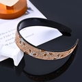 Sparkling champagne gold rhinestone headband with leopard pattern on black base - Three-Leaf Champagne Gold