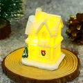 Detailed view of glowing resin Christmas cafe house model with warm light and festive pine - Style I