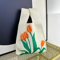 Knitted tote bag with orange tulip pattern and sturdy single handle on a metal stand - Beige and Red Tulip