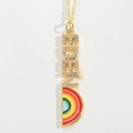 Detailed shot of golden necklace with EDEN pendant and colorful enamel rainbow pattern - EDEN Letter / Rainbow