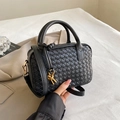 Black hand-woven Boston pillow bag with golden knot hardware and leather shoulder strap - Black