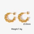 Macro detail of 18K gold-plated twisted C-hoop earrings with 23.6mm diameter and 7.4g weight - Gold