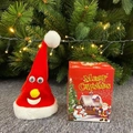 Plush Santa hat doll with white beard and matching gift box under Christmas tree - Shaking Hat