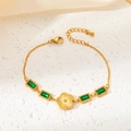 Detail of gold bracelet with green square gemstones and radiant petal pendant - Green Rhinestone Square Flower Style
