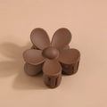 Close-up of matte dark brown flower hair claw clip with durable spring and five petals - Individual Packaging / Dark Brown