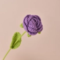 Handmade crochet rose flower in vibrant purple yarn with green stem and leaf detail - Dark Purple Rose
