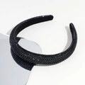 Detail shot of black rhinestone headband with dense crystal embellishments and velvet base - Black
