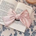 French vintage dusty pink satin bow hair clip placed on a book for hair accessory - Bow Scrunchie / Light Pink