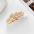 Macro view of a large cream floral banana hair clip with pearlescent acrylic finish - Off White