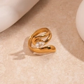 Macro view of water-drop zircon and golden irregular open ring on stone surface - Chunky Streamlined Teardrop Zircon Gold Ring (42#)