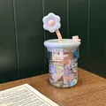 Detail of high borosilicate glass cup with pink 3D flower straw and blue lid - Blue