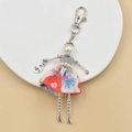 Handmade doll keychain with silver sequins, floral skirt, and white pearl head detail - 24-Floral Sequin Top Doll