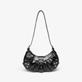 Detail of glossy black hobo bag featuring silver rivets and metal buckle hardware - Smooth Black
