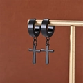 Detail of matte black stainless steel cross earrings hanging on a gold display stand - Black (C-2)