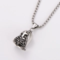 Detailed close-up of a silver stainless steel bell pendant with relief cross and dragon motifs - Steel Color - With 3.5mm*60cm Chain