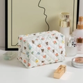 White quilted floral cosmetic bag with cute bear pattern and secure zipper closure - Flower Bear