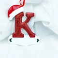 Sparkly red glitter Christmas letter K ornament with Santa hat and name plate - Letter K