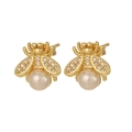 Golden bee stud earrings with pearl abdomen and sparkling zircon wings on white background - Gold Bee Pearl