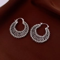 Detailed view of silver-plated hollow woven chain hoop earrings with a metallic finish - Silver
