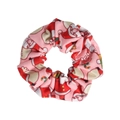 Detailed view of pink Christmas scrunchie featuring cute Santa Claus holiday patterns - Pink