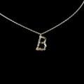 Silver letter B pendant necklace with colorful cubic zirconia stones on black background - Letter B / Silver