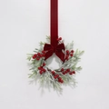 Detail of Christmas wreath with red berries, pine needles and velvet ribbon bow - Red Velvet Bow