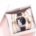 Close-up of stylish black cat dial watch set with golden bracelets in white gift box - Watch + Bracelet + Box / Black