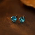 S999 silver stud earrings with blue round birthstone in a classic four-claw setting - December Turquoise