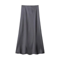 Detail of elegant charcoal grey satin midi skirt featuring silky texture and drape - Gray