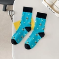 Blue cotton socks with bee patterns and black cuffs laid on a clean white surface - One Size / Blue Base Bee