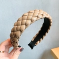 Detailed view of khaki braided PU leather headband featuring a thick woven texture - Style 1 Wide / Beige