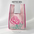Detail of pink floral knitted handbag with macro view of rose texture and craftsmanship - Goddess Rose