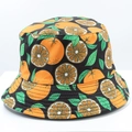 Detailed close-up of the bucket hat featuring vibrant orange citrus patterns on black fabric - 12# Black Orange Slices Print