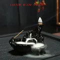 Black ceramic backflow incense burner with mountain design and cascading smoke effect - Perfect Union