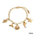 Bracciale dorato in acciaio inossidabile con ciondoli marini, conchiglia, delfino e stella - Bracciale Oro (KB926)