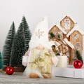 Detail of white snowflake hat Christmas gonk with golden braids and gift box decor - Female Rudolf Gnome (White Hat & Braids)