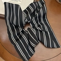 Elegant black and white striped scrunchie with bow detail on a vintage wood surface - Black Striped Scarf Scrunchie