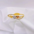 Minimalist gold heart cuff bracelet featuring crystal zircon inlay on white satin - Gold