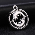Macro detail of silver Pisces zodiac pendant with intricate fish design and rope border - Style 6 / Antique Silver