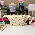 Cream canvas chest bag with cute cartoon dachshund and bow prints on a desk - Light Yellow